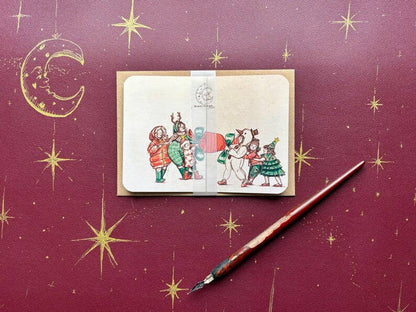 Vintage Christmas Cracker Card “The Carol Singers”