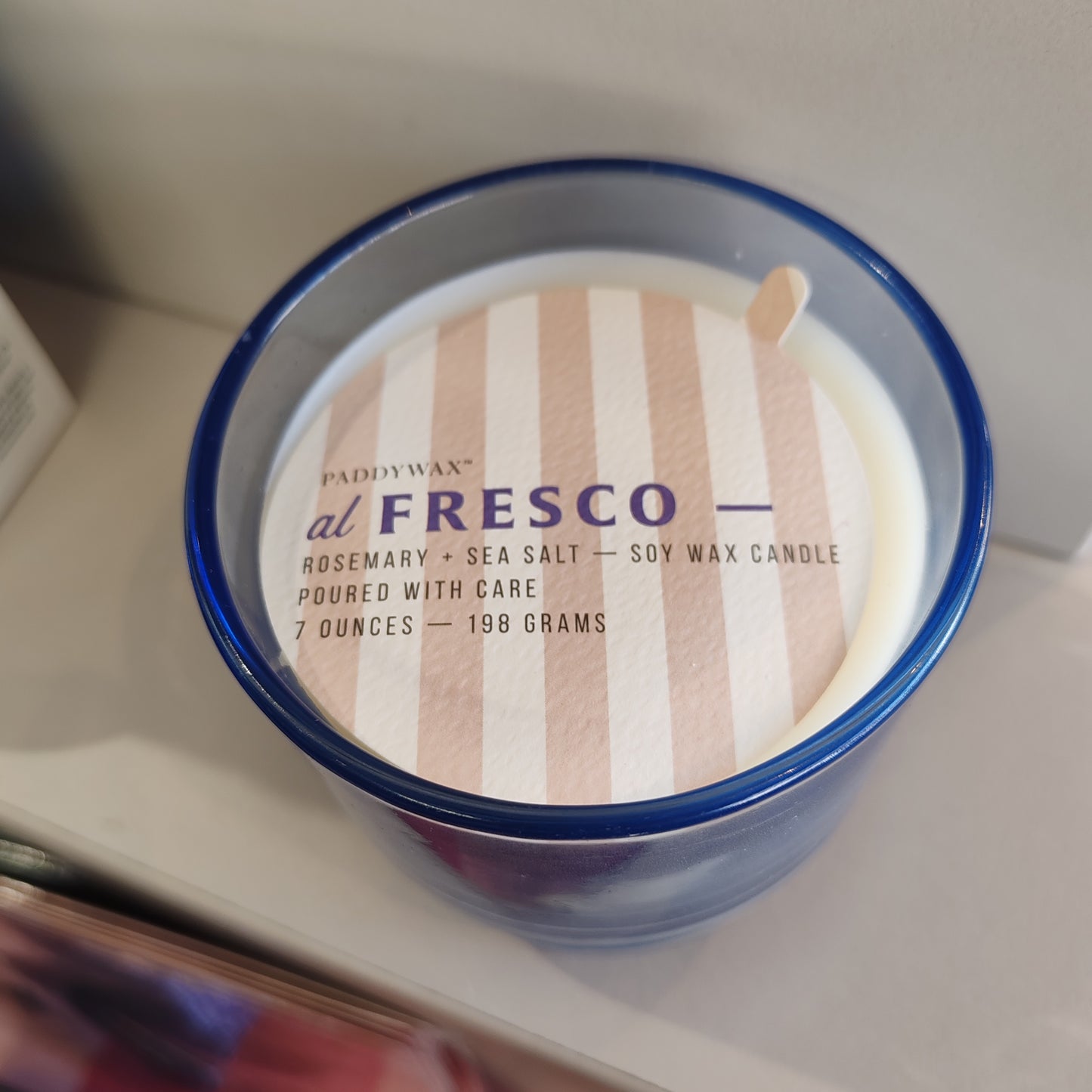 Al Fresco Soy Wax Candle in blue glass Jar. 7oz. Scent of Rosemary and Sea Salt