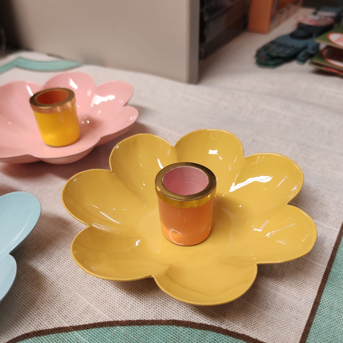 Enamel metal flower candle holder.