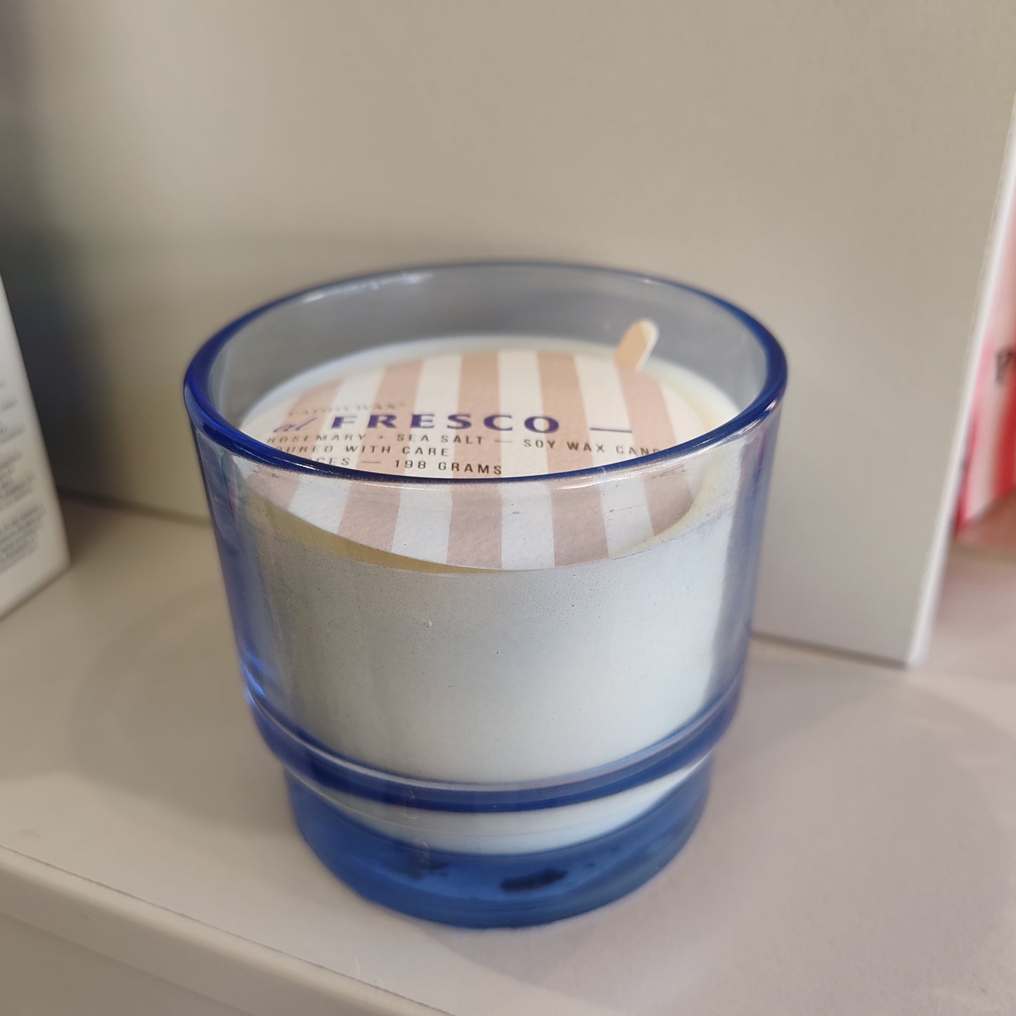 Al Fresco Soy Wax Candle in blue glass Jar. 7oz. Scent of Rosemary and Sea Salt
