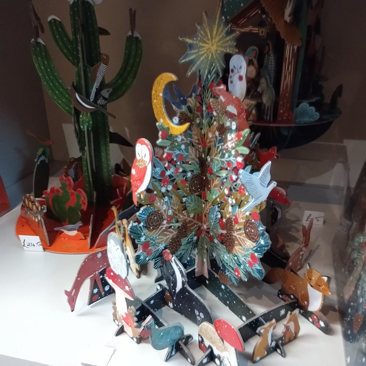 Pop and slot advent calendar . Beneath the tree Christmas theme.