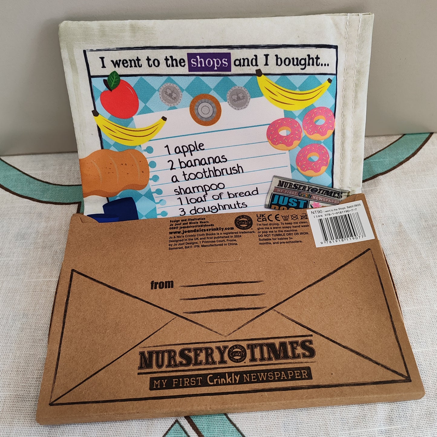 Crinkly sensory first cloth book - I went to the shops.