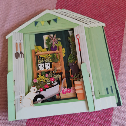 Miniature world Greeting card. Pop up Garden shed Theme