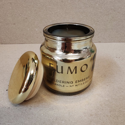 Chrome 2.5oz scented candle in gold metallic glass container . Scent of Smoldering embers.