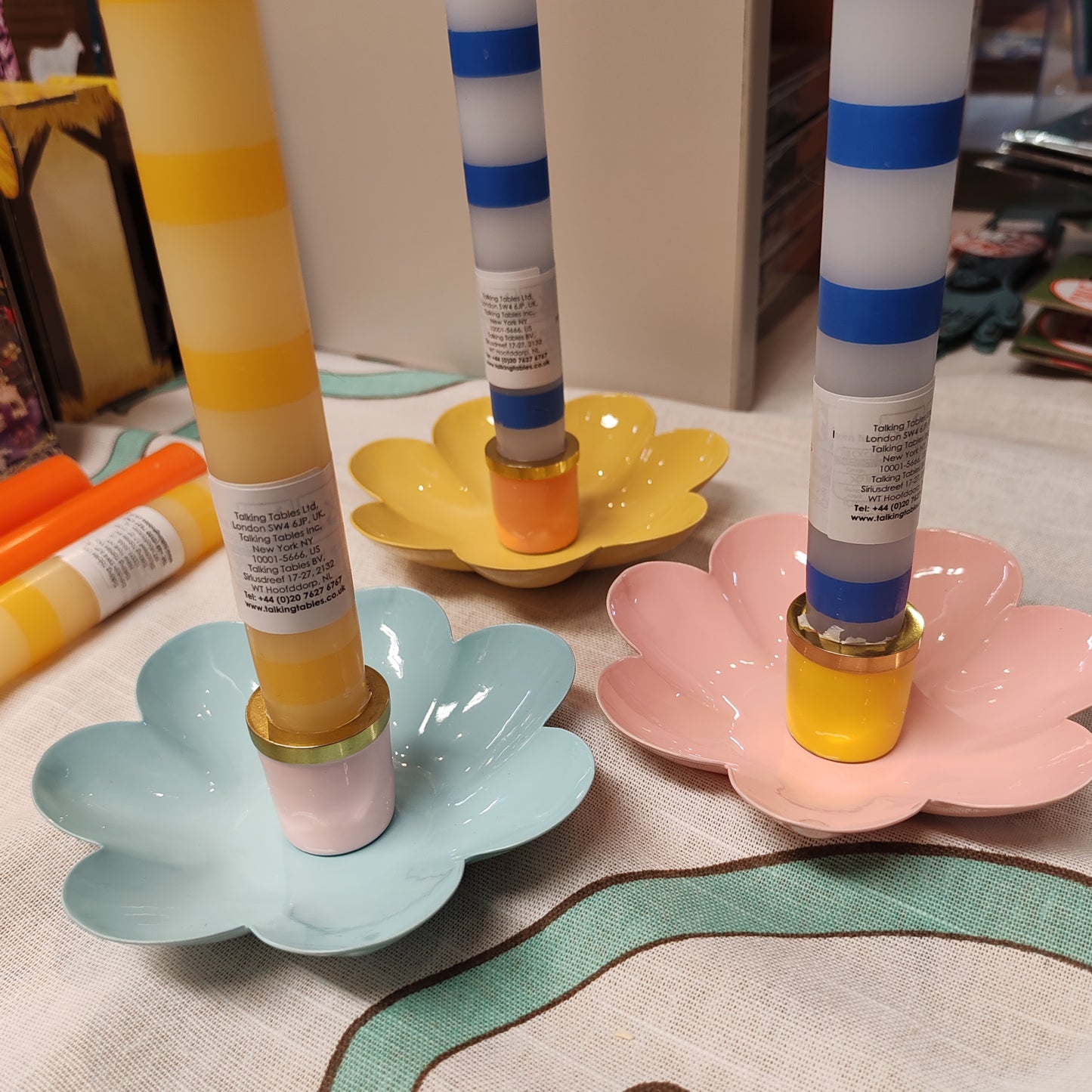 Enamel metal flower candle holder.