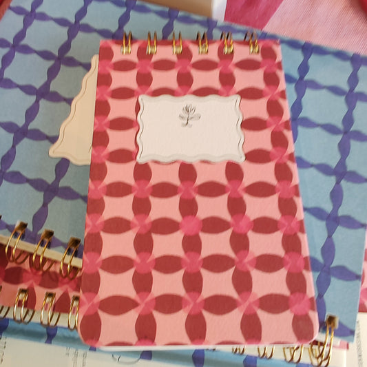 Pinwheel design wire pocket notebook.