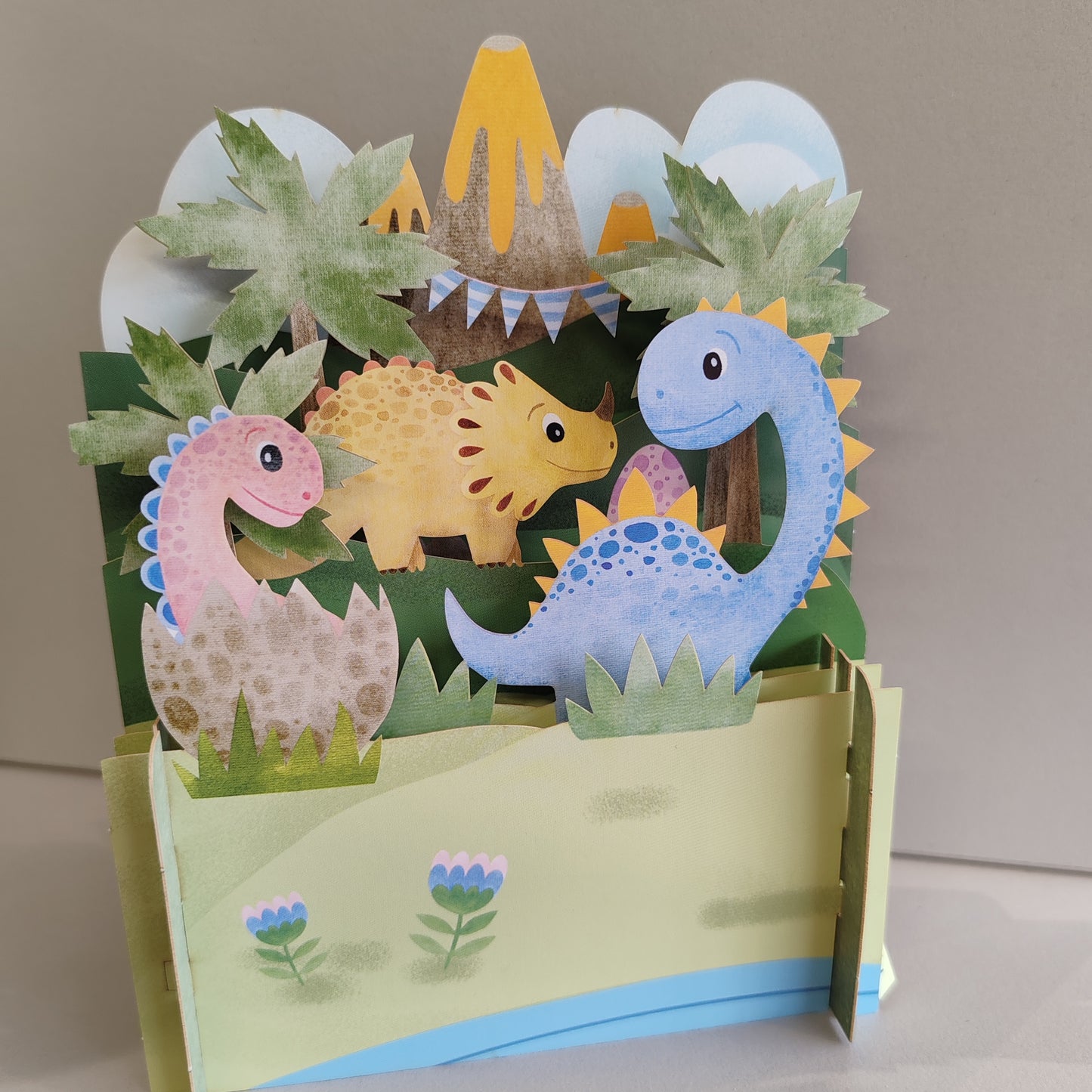 Miniature world 3D pop up greeting card. Dinosaur theme.
