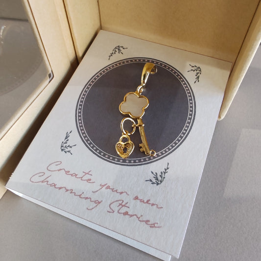14k gold plated Mother of Pearl key lock clip on charm