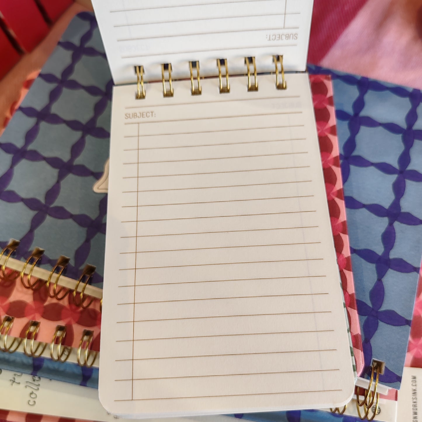 Pinwheel design wire pocket notebook.