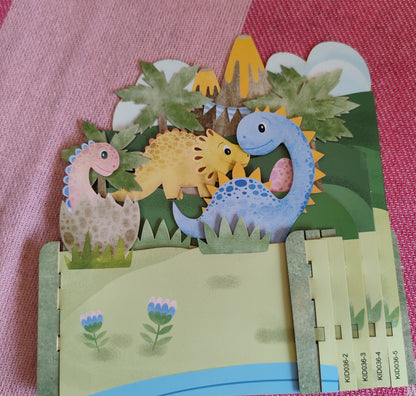 Miniature world 3D pop up greeting card. Dinosaur theme.