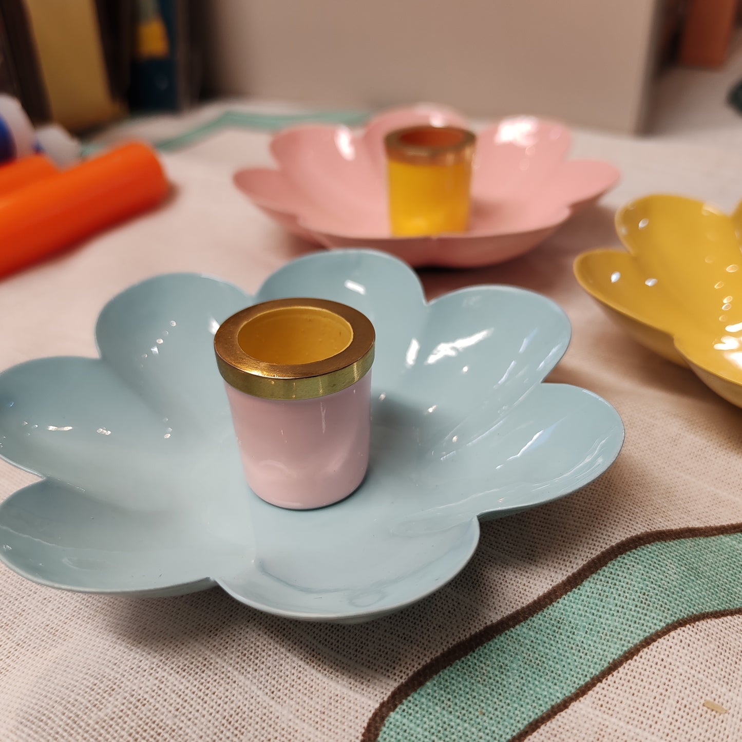 Enamel metal flower candle holder.