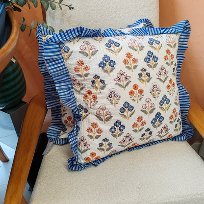 Large white / multi coloured floral cushion cover will a blue white striped frill