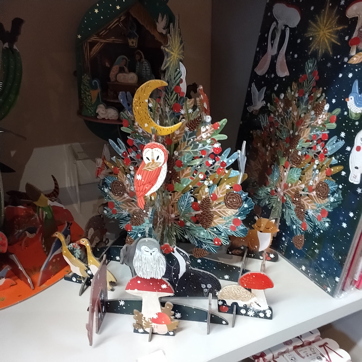 Pop and slot advent calendar . Beneath the tree Christmas theme.