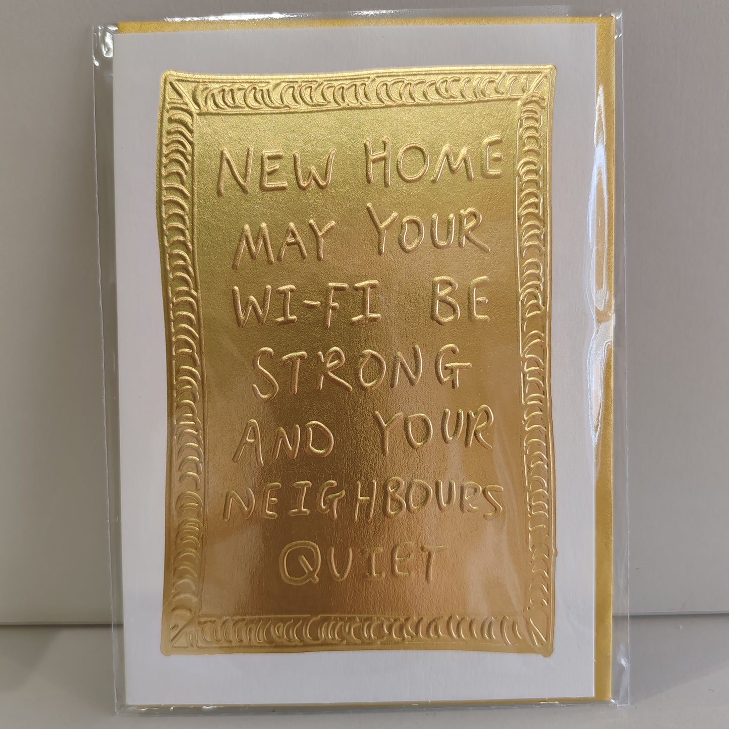 Gold embossed New Home greeting card.
